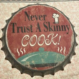 NWT’s- Never Trust a Skinny Cook metal sign in the shape of a opened bottle cap